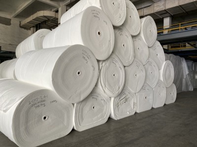 Nonwoven geotextile and woven geotexitle